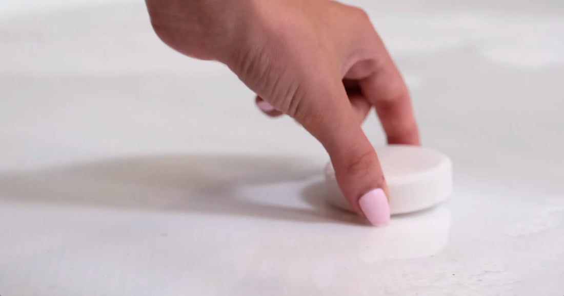 Placing Satavi Naturals shower steamers in the shower