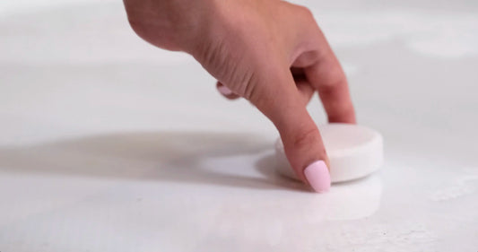 Placing Satavi Naturals shower steamers in the shower