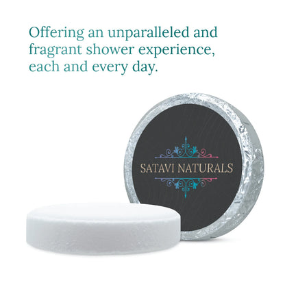 Unwrapped Satavi Naturals premium shower steamer tablet with foil packaging.